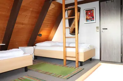 Ein Bett oder Betten in einem Zimmer der Unterkunft Ferienhaus Winnetou Schwarzkittelpfad 85