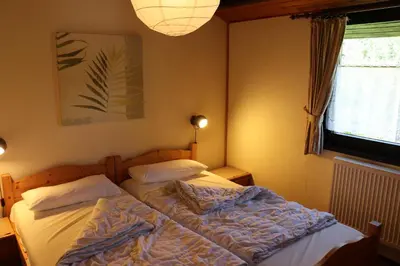 Ein Bett oder Betten in einem Zimmer der Unterkunft Ferienhaus Robinson Crusoe Schwarzkittelpfad 77