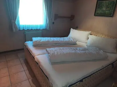 Ein Bett oder Betten in einem Zimmer der Unterkunft Ferienhaus Robinson Romantikpfad 164