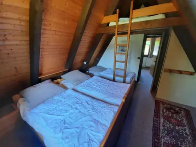 Ein Bett oder Betten in einem Zimmer der Unterkunft Ferienhaus Winnetou Sonnenkreisel 145