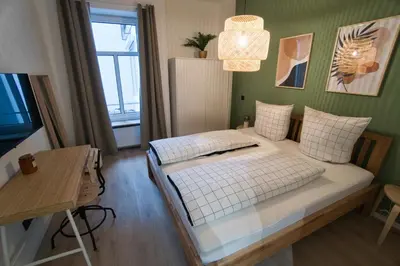 Ein Bett oder Betten in einem Zimmer der Unterkunft Goethe-Suites: Premium 4 Person Worms city centre Appartment