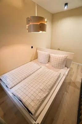 Ein Bett oder Betten in einem Zimmer der Unterkunft Goethe-Suites: Premium 4 Person Worms city centre Appartment