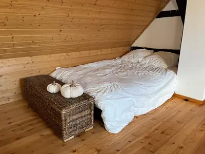 Ein Bett oder Betten in einem Zimmer der Unterkunft Olive Garden