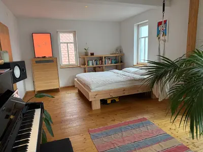 Ein Bett oder Betten in einem Zimmer der Unterkunft Olive Garden
