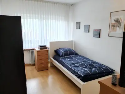 Ein Bett oder Betten in einem Zimmer der Unterkunft 123-Zimmerverleih Mosbach