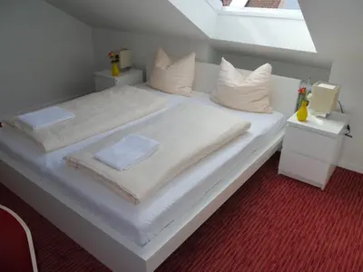 Ein Bett oder Betten in einem Zimmer der Unterkunft Mille Stelle Hotel