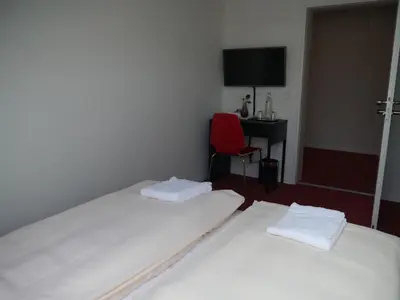 Ein Bett oder Betten in einem Zimmer der Unterkunft Mille Stelle Hotel