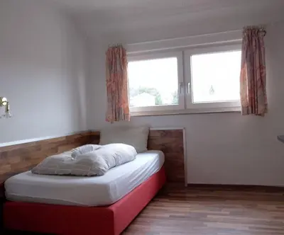 Ein Bett oder Betten in einem Zimmer der Unterkunft Bew Monteurzimmer - Waldbronn
