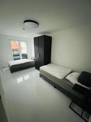 Ein Bett oder Betten in einem Zimmer der Unterkunft Moderne Wohnung nahe Museum