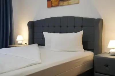 Ein Bett oder Betten in einem Zimmer der Unterkunft Bovino Hotel