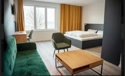 Ein Bett oder Betten in einem Zimmer der Unterkunft Hotel Central Vis a Vis