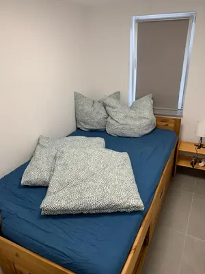 Ein Bett oder Betten in einem Zimmer der Unterkunft Ferienstüble im Zabergäu- Ferienwohnung