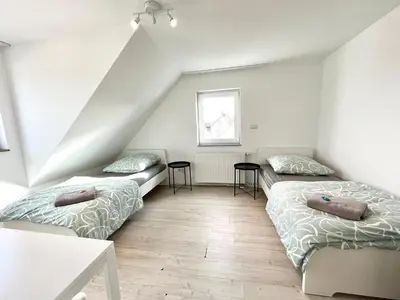 Ein Bett oder Betten in einem Zimmer der Unterkunft Handwerker Wohnung - Parkplatz vor der Türe - Balkon - bis zu 6 Personen