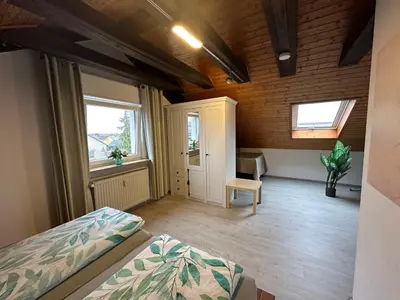 Ein Bett oder Betten in einem Zimmer der Unterkunft Ferienwohnung Löchgau