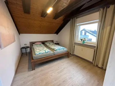 Ein Bett oder Betten in einem Zimmer der Unterkunft Ferienwohnung Löchgau