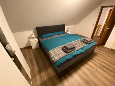 Ein Bett oder Betten in einem Zimmer der Unterkunft Appartement am Kaibach - Küche - Balkon - Bad