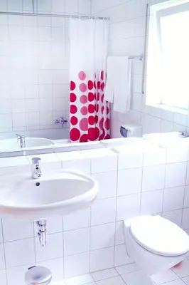 Ein Badezimmer in der Unterkunft Hotel Pension Kaempfelbach
