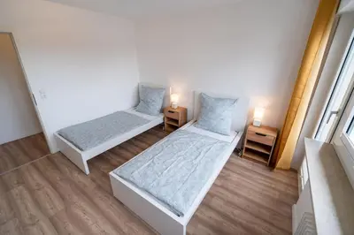 Ein Bett oder Betten in einem Zimmer der Unterkunft bookandstay24 com Münster bei Darmstadt, Frankfurt, Rhein Main Gebiet