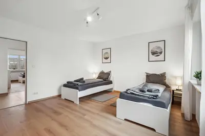 Ein Bett oder Betten in einem Zimmer der Unterkunft SC01 Großes Apartment bei FFM!
