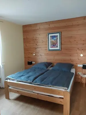 Ein Bett oder Betten in einem Zimmer der Unterkunft Ferienwohnung Zum Backenzahn