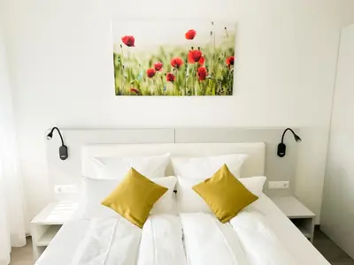 Ein Bett oder Betten in einem Zimmer der Unterkunft GuestHouse Große Linde
