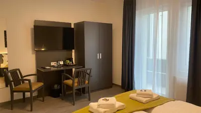 Ein Bett oder Betten in einem Zimmer der Unterkunft GuestHouse Große Linde