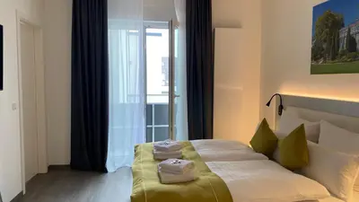 Ein Bett oder Betten in einem Zimmer der Unterkunft GuestHouse Große Linde