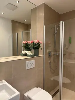 Ein Badezimmer in der Unterkunft GuestHouse Große Linde