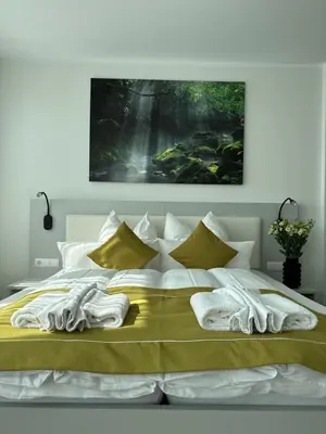 Ein Bett oder Betten in einem Zimmer der Unterkunft GuestHouse Große Linde