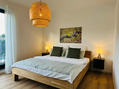 Ein Bett oder Betten in einem Zimmer der Unterkunft Vyne Apartments - Terrasse - Grill - Privatparkplatz