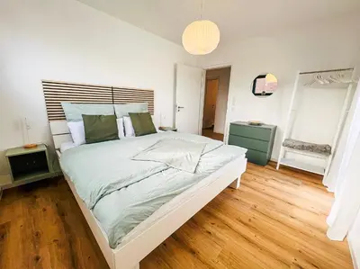 Ein Bett oder Betten in einem Zimmer der Unterkunft Vyne Apartments - Terrasse - Grill - Privatparkplatz