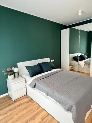Ein Bett oder Betten in einem Zimmer der Unterkunft Neuwertiges Apartment in zentraler Lage