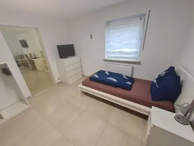 Ein Bett oder Betten in einem Zimmer der Unterkunft Schöne helle Wohnung in Malsch