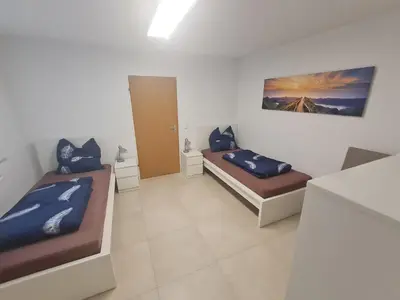 Ein Bett oder Betten in einem Zimmer der Unterkunft Schöne helle Wohnung in Malsch