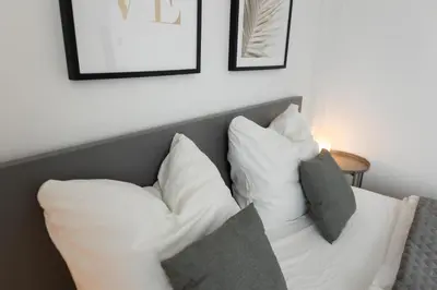 Ein Bett oder Betten in einem Zimmer der Unterkunft HUGOS Design Apartment