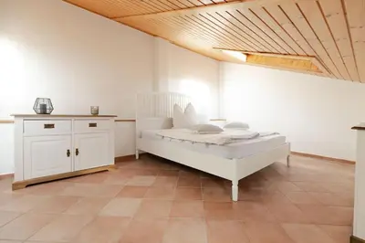 Ein Bett oder Betten in einem Zimmer der Unterkunft Helles Gästehaus in St. Johann