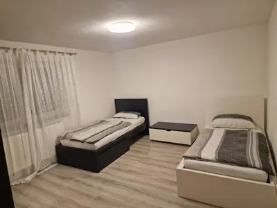 Ein Bett oder Betten in einem Zimmer der Unterkunft Ferienwohnung Sumi