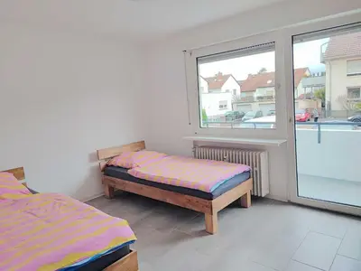 Ein Bett oder Betten in einem Zimmer der Unterkunft Schöne Wohnung 90 Uni Nah Mainz