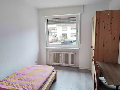 Ein Bett oder Betten in einem Zimmer der Unterkunft Schöne Wohnung 90 Uni Nah Mainz