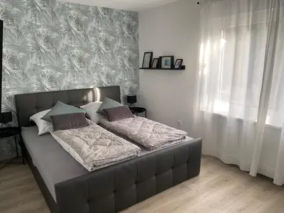 Ein Bett oder Betten in einem Zimmer der Unterkunft Am Kienbusch - Südliche Weinstraße - Erdgeschoss