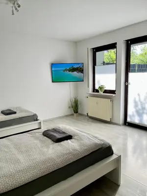 Ein Bett oder Betten in einem Zimmer der Unterkunft L5 Apartments - Ganze Wohnung, Küche, Bad, WLAN, Terrasse