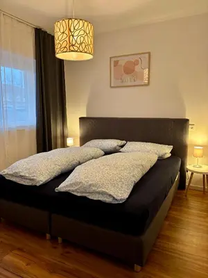 Ein Bett oder Betten in einem Zimmer der Unterkunft LA-Hüttenfeld Erdgeschoss Apartment