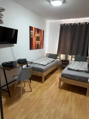 Ein Bett oder Betten in einem Zimmer der Unterkunft Appartement in Heidelberg mit Balkon