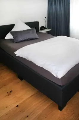 Ein Bett oder Betten in einem Zimmer der Unterkunft Adlerhorst - Boarding House