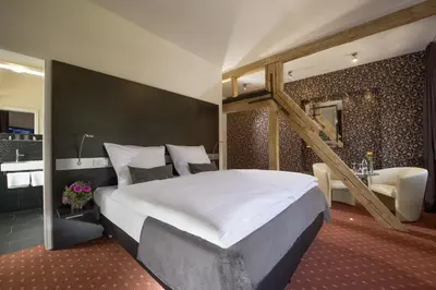 Ein Bett oder Betten in einem Zimmer der Unterkunft Hotel Landgasthof König von Preussen