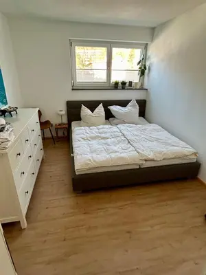 Ein Bett oder Betten in einem Zimmer der Unterkunft Cube - Ferienhaus mit Garten und Terrasse in Eberbach