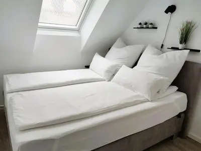 Ein Bett oder Betten in einem Zimmer der Unterkunft Modernes zentrales Apartment
