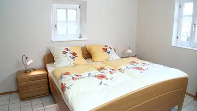 Ein Bett oder Betten in einem Zimmer der Unterkunft Alte Hütte