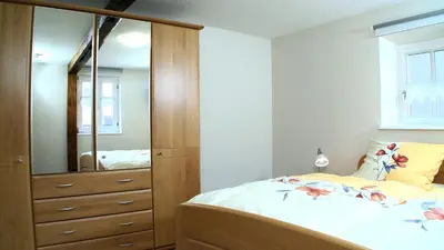 Ein Bett oder Betten in einem Zimmer der Unterkunft Alte Hütte