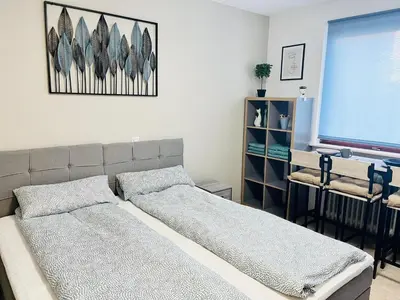 Ein Bett oder Betten in einem Zimmer der Unterkunft LENASTAY I Modernes Apartment-Studio near Uni